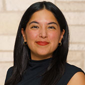 young woman with brown hair smiling